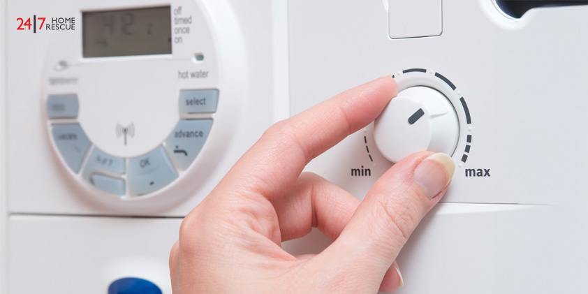 How to Prepare Your Boiler for Winter Close-up of user controlling boiler pressure settings