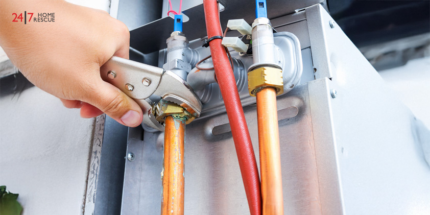 How to Prepare Your Boiler for Winter Engineer repairing gas boiler in home