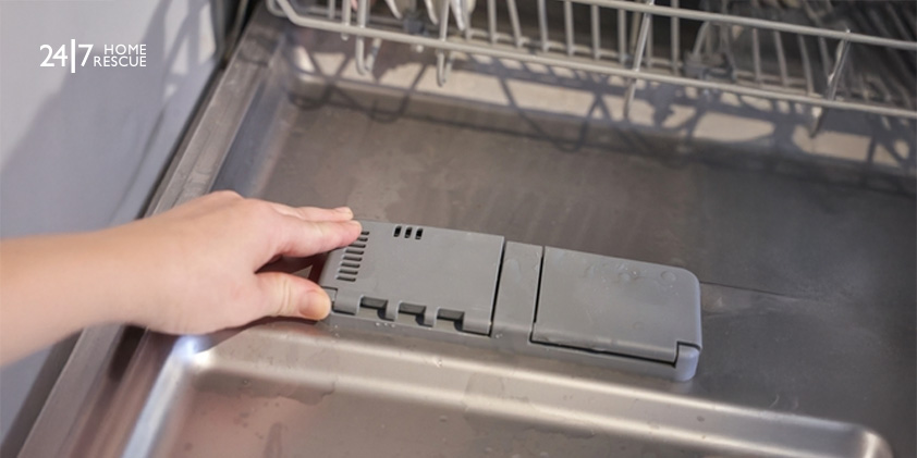 Dishwasher Not Filling with Water? Causes & Fixes Explained woman loading a dishwasher with its door open while doing household chores