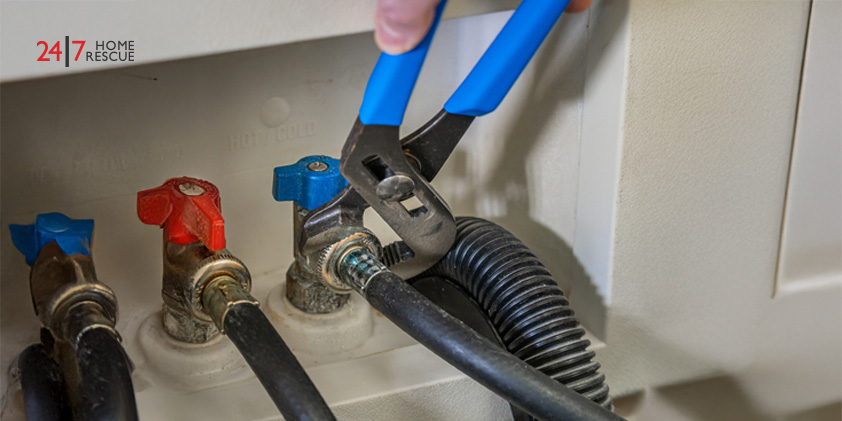 Dishwasher Not Filling with Water? Causes & Fixes Explained A plumber using a wrench to connect the water supply line to the shut-off valve of a washing machine