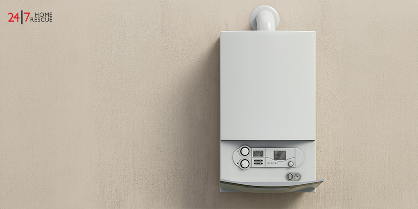 Close-up of a white wall-mounted boiler with control panel