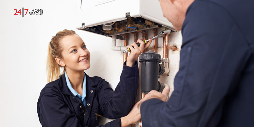 Boiler Repair Cost 2026: A Complete Breakdown Person learning about boiler service tips with female engineer