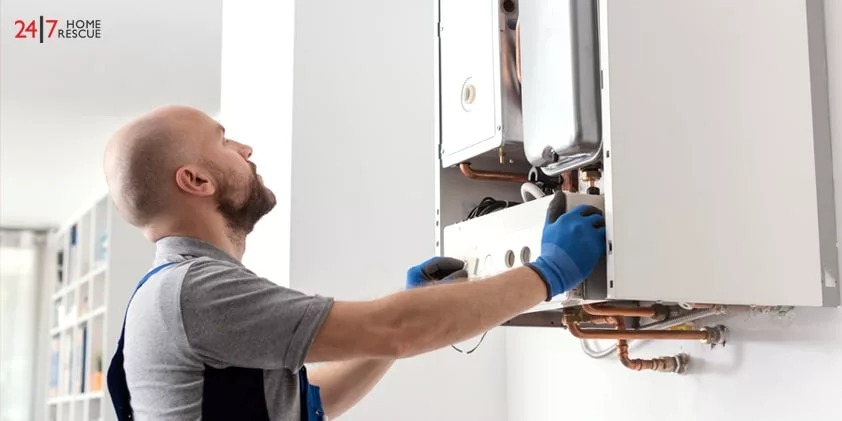 Boiler Repair Cost 2026: A Complete Breakdown An engineer is repairing a boiler