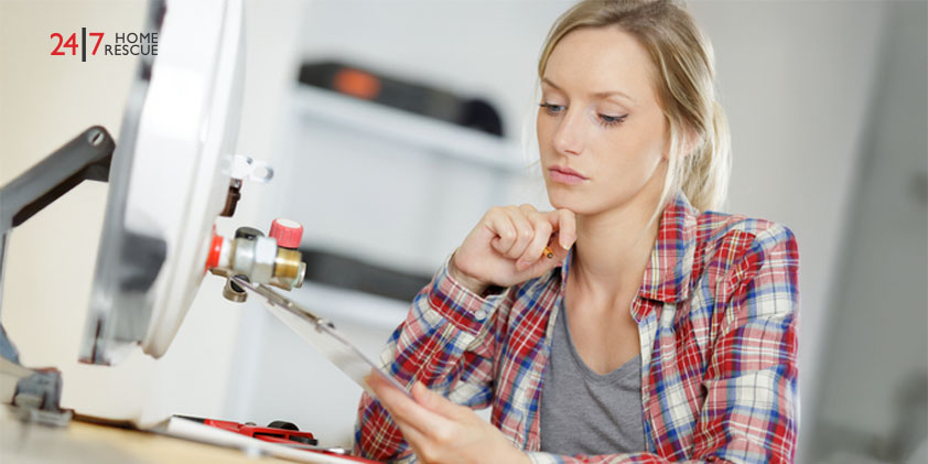 Boiler Repair Cost 2026: A Complete Breakdown Women analyzing boiler service instructions for a heating system