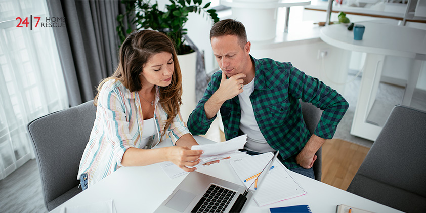 Couple reviewing documents together at table