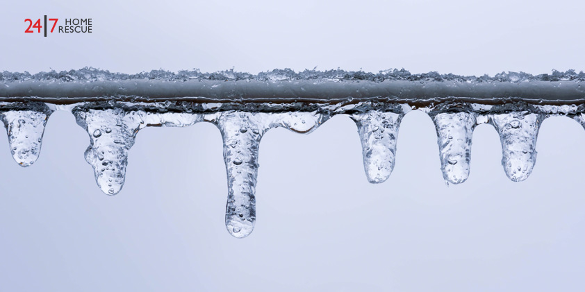 E1 Boiler Error Code: What It Means & How to Fix It A frozen pipe with hanging icicles, highlighting a common winter plumbing risk