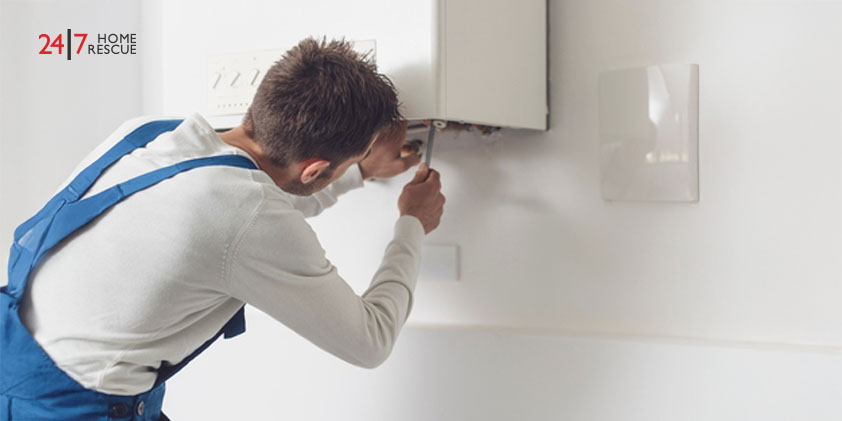 Boiler Lockout and Ignition Lockout Causes & How To Fix It Engineer performing boiler inspection and pipe maintenance