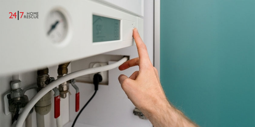 A Comprehensive Guide to Understanding Glow Worm Boiler Pressure: Common Issues and Effective Solutions Person presses a button on a gas boiler control panel