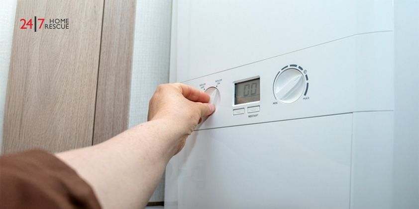 Worcester Boiler No Hot Water: Diagnosis and Fixes Person adjusting boiler temperature