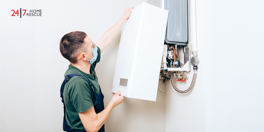 Reasons Why There Is no Hot Water in Your Shower Engineer working to repair a gas boiler in a residential heating system