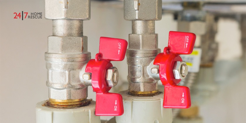 Combi Boiler Flow Rate Explained: A Homeowner’s Guide Hot and cold water control valves of a combi boiler