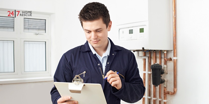 Can You Have a Boiler in a Bedroom? Important Factors to Consider An image showing an engineer performing inspection on a modern gas boiler