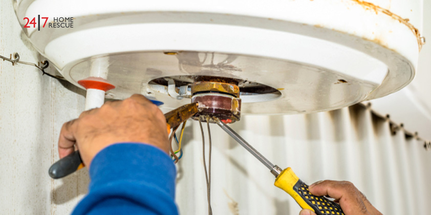 Worcester E9 Fault Code: Overheating and Systems Issues Explained An engineer performing repairs on a gas boiler’s wiring