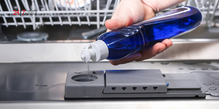 How Much Does It Cost to Run a Dishwasher A man pouring cleaning supplies in a dishwasher’s compartment