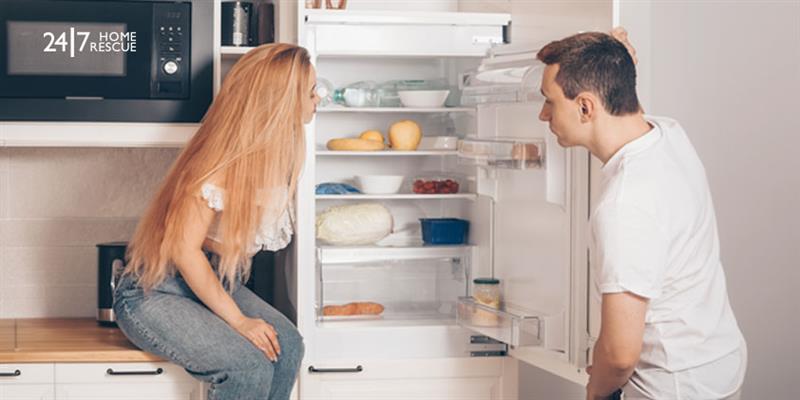 Common Fridge Freezer Faults and How To Get Them Fixed A man and woman worried about the fridge-freezer not cooling properly