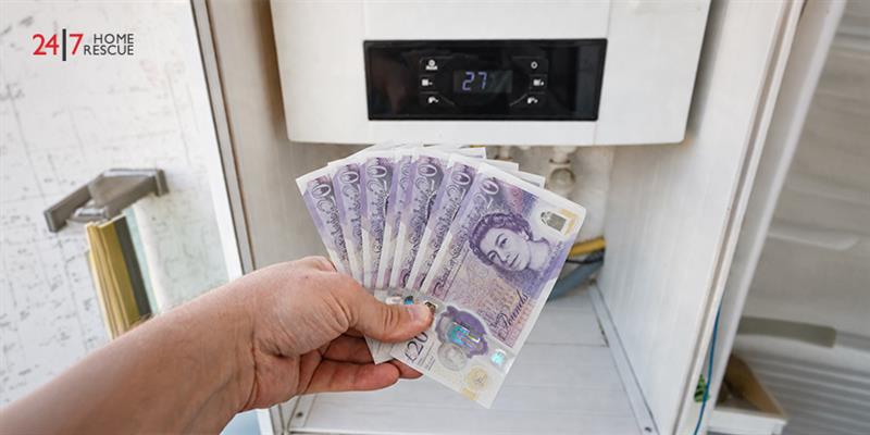 Is Boiler Cover Worth It? Everything You Need to Know Hand holding pound notes near boiler