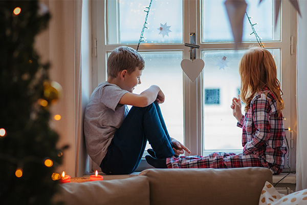 Two children looking out the window