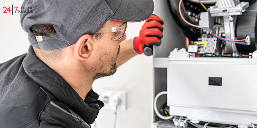 Engineer inspecting boiler internal components